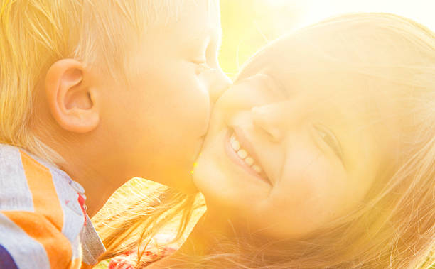 istock Shildren kissing 586935766