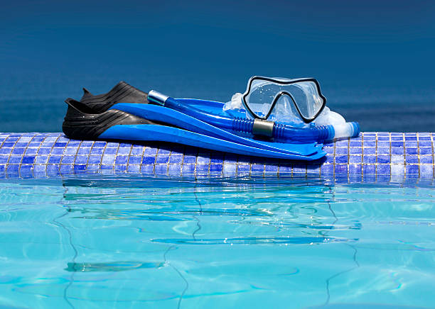 istock Scuba mask with blue flippers 586936148