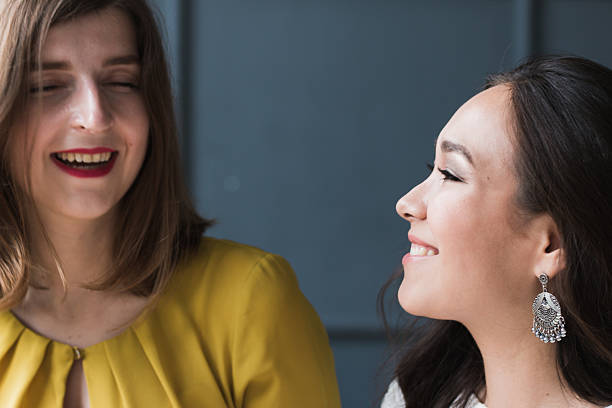 istock Portrait of two women laughing 586936712