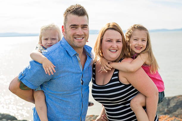 istock Family having great time ocean 586936780
