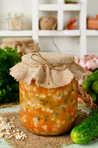 istock Soup in a jar. Pickle from barley and cucumber 586937092
