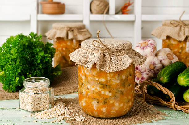 istock Soup in a jar. Pickle from barley and cucumber 586937190