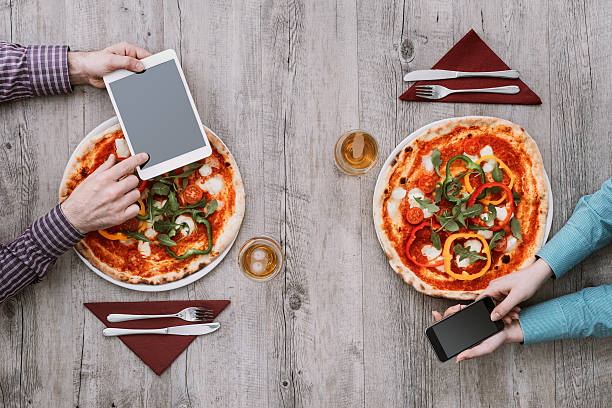istock Friends eating pizza together 586938464