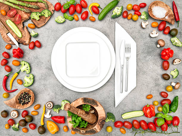 istock Table setting with fresh vegetables. Healthy food 586938628