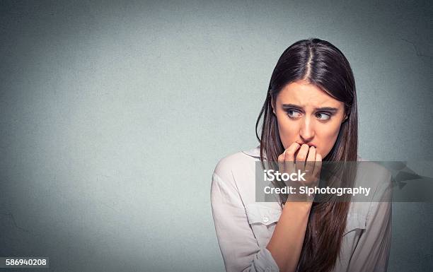 Young Nervous Woman Biting Fingernails Craving Or Anxious Stock Photo - Download Image Now