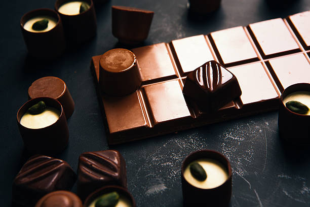 istock Many chocolate sweets with  Pistachio on black background 586940246