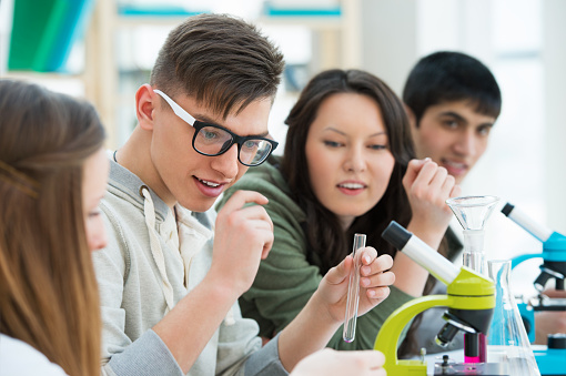 High School students. Group of students working together at laboratory class.