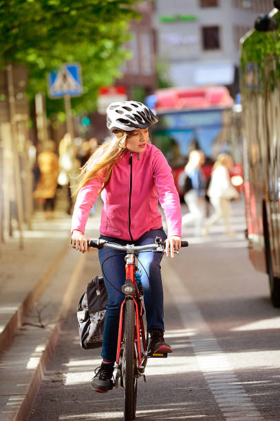 istock Swedish girl and bicycle in traffic 586941184