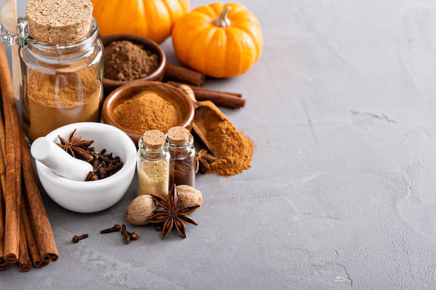 Pumpkin pie spice in a glass jar with ingredients Homemade pumpkin pie spice in a glass jar with ingredients fall spices stock pictures, royalty-free photos & images