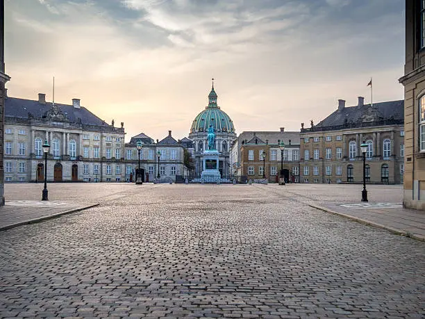 Photo of The square of Amalienborg Royal Palace . Copenhagen, Denmark, dawn