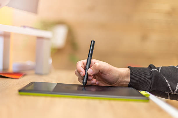 istock Designer working with a pen tablet in an office 586943256