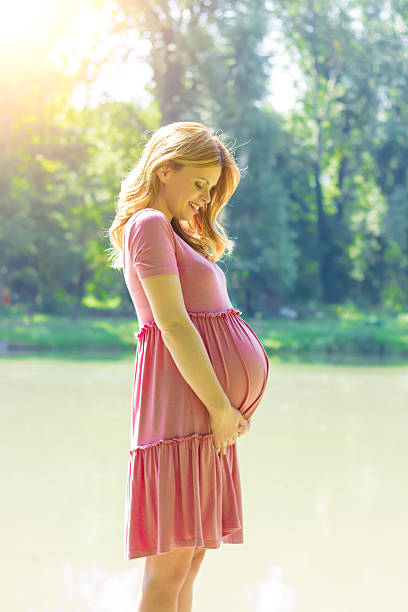 istock beautiful young pregnant woman 586944014