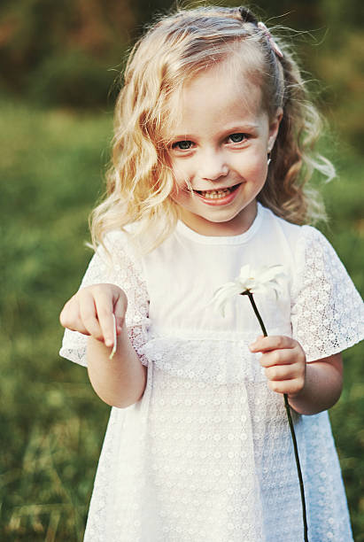 istock Little girl walking in the park 586948206
