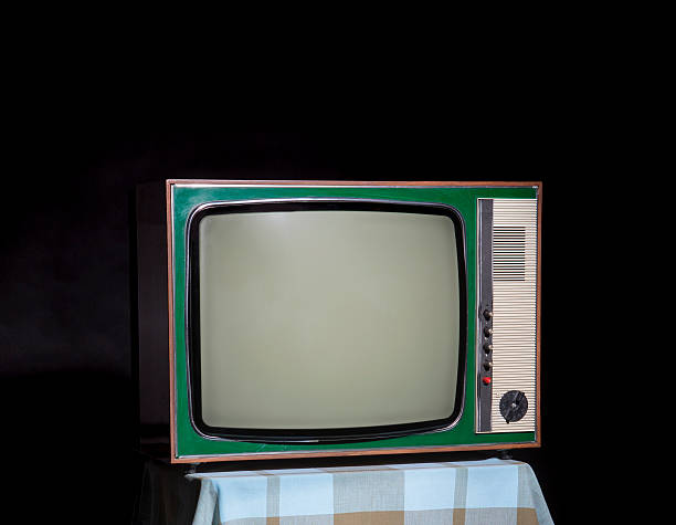 istock Vintage green TV, at the table with blue checkered tablecloth 587183632