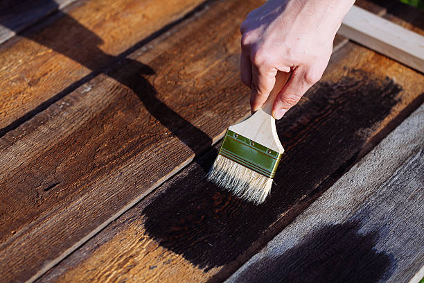 istock Paint brush on wooden table use for home decorated. 587185720