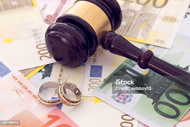 Family Law Concept Gavel Rings And Money On Wooden Table Stock Photo - Download Image Now