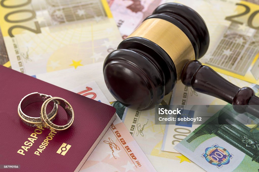 Family law concept, gavel, rings and money on wooden table Bar Code Reader Stock Photo