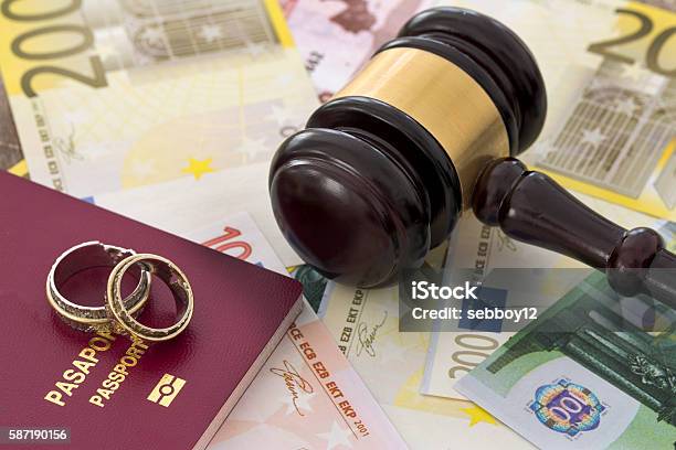 Family Law Concept Gavel Rings And Money On Wooden Table Stock Photo - Download Image Now