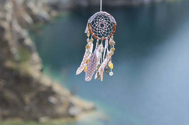 istock Handmade native american dream catcher on background of rocks an 587190724