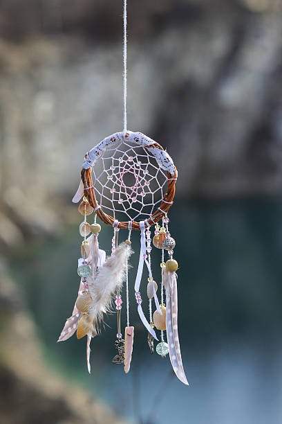 istock Handmade native american dream catcher on background of rocks an 587190908