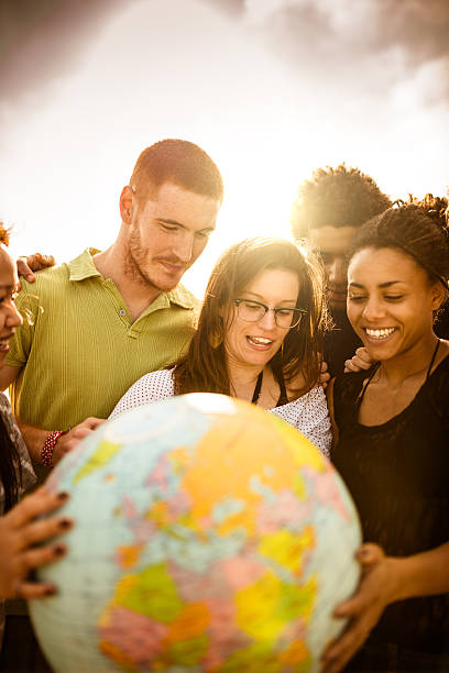 istock teenagers college student smiling with globe 587191630