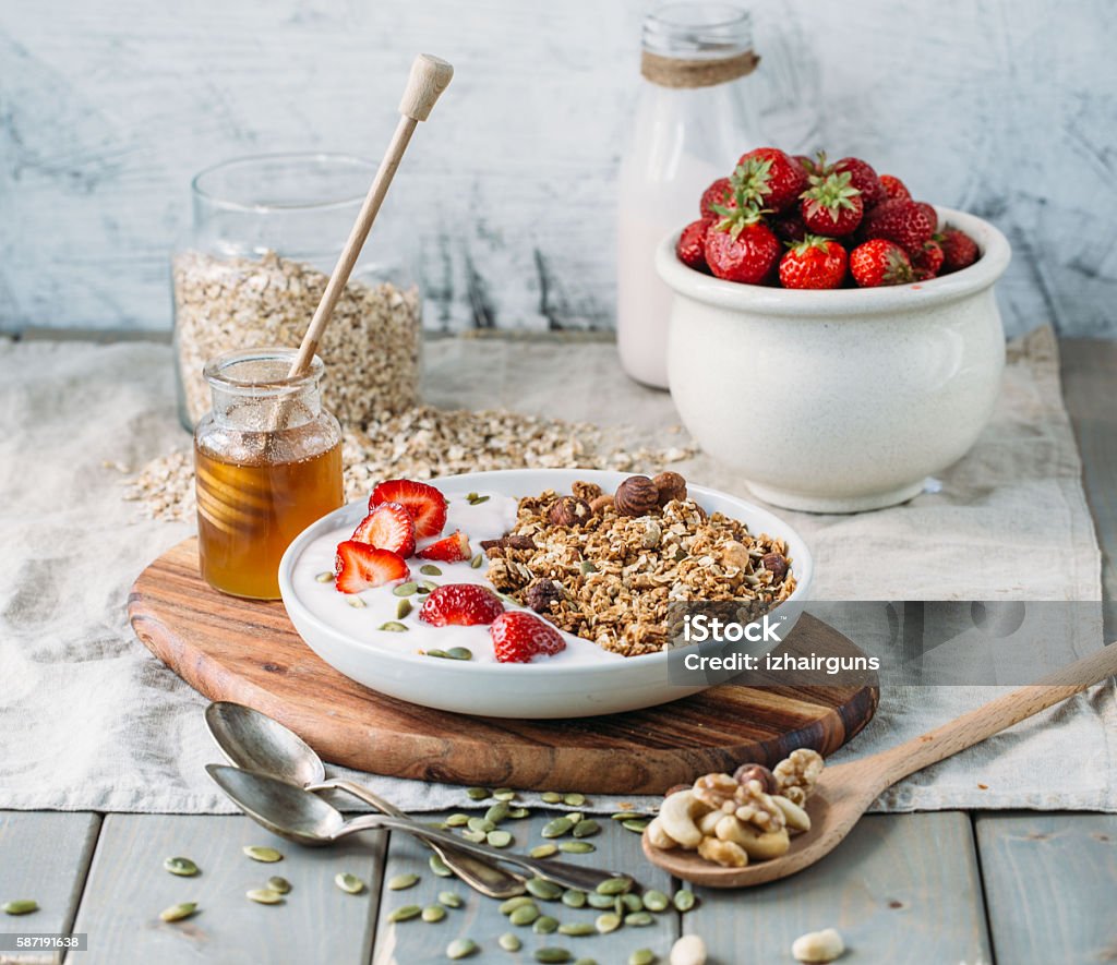 Homemade granola with fresh strawberry over vanilla yogurt. Healthy breakfast Breakfast Stock Photo