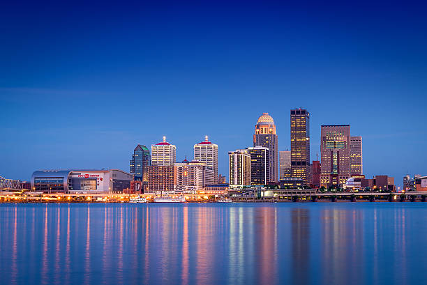 Louisville, Kentucky Skyline looking across the river just after sunset at the Louisville, Kentucky skyline. ohio river photos stock pictures, royalty-free photos & images