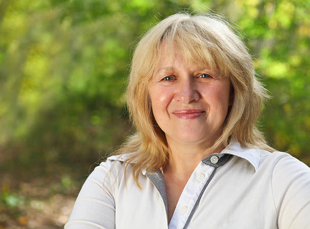 istock Middle aged woman outdoors 587194780