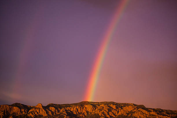 istock inspiring nature rainbow mountain sunset 587194976