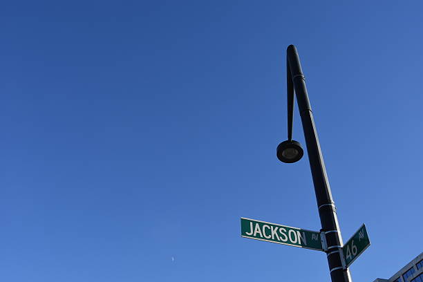 istock Low Angle View Of Information Sign On Pole Against Clear Blue Sky 587195869