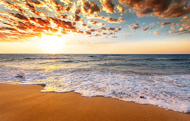 istock Beautiful sunrise over the tropical beach. 587197128