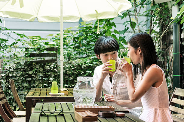 istock Young Japanese couple on a terrace 587197634