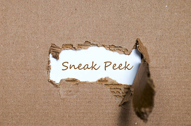 istock The word sneak peek appearing behind torn paper. 587197742