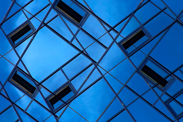 Double exposure of all-over glazed ceiling / roof with ajar windows. Unconventional fragment of business cityscape. Structural geometric composition on the subject of contemporary architecture.