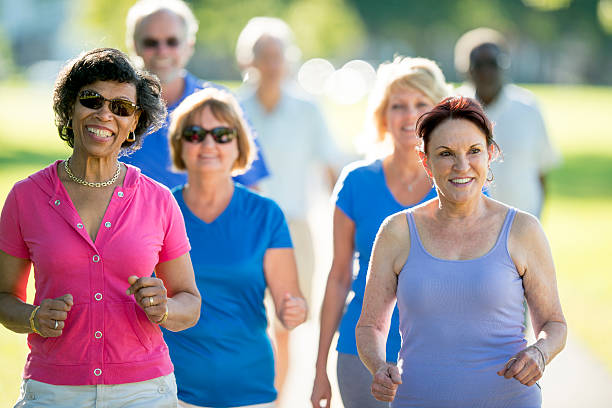 istock Seniors Walking Together Through the Park 587199464