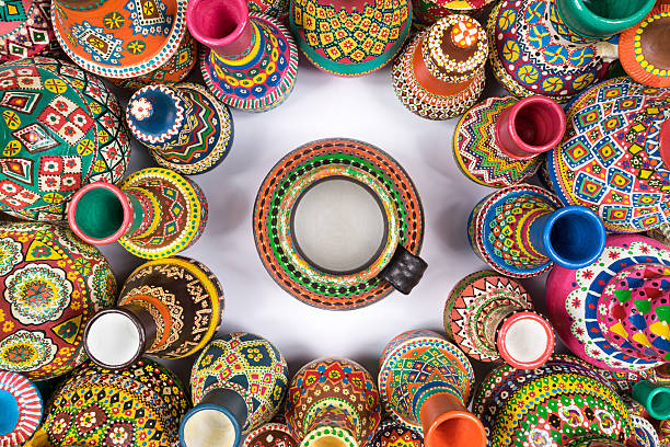 istock Colorful pottery vases compacted in a circle around single vase 587200390
