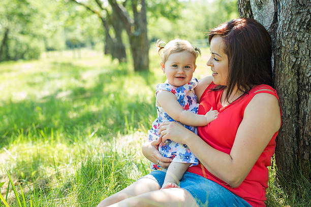 istock Mother and daughter in forest having fun 587200804