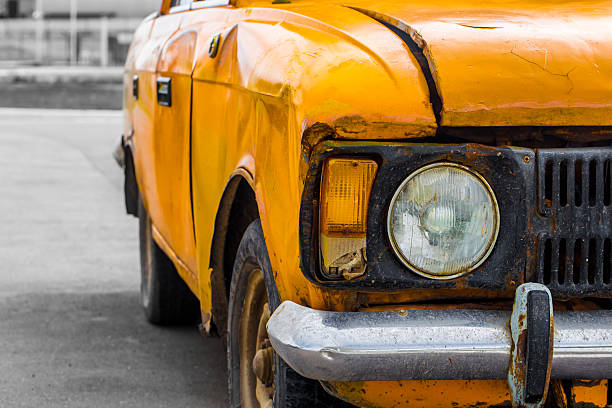 istock Vintage car yellow. Closeup. Broken. 587202214
