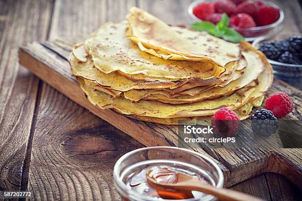 Pancake Crepes With Berries Mint And Honey Stock Photo - Download Image Now - Crêpe - Pancake, Baked Pastry Item, Berry Fruit