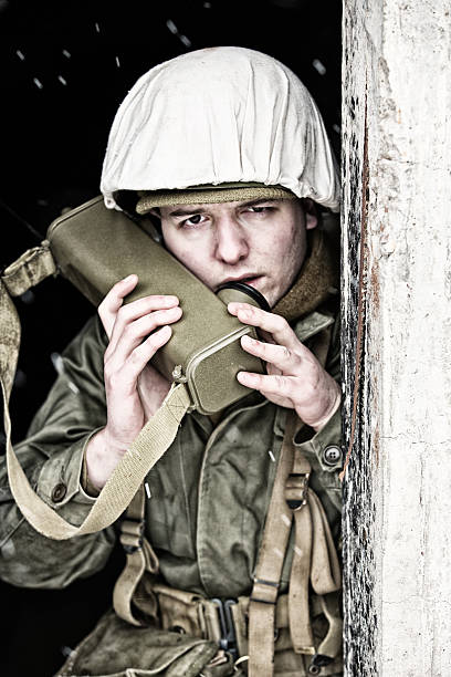 istock WWII Radio Man Calling In Strike From Bunker In Winter 587204484