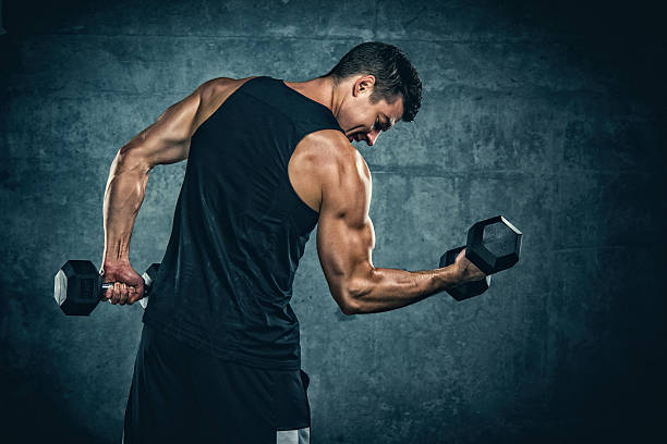Exercise With Weights Athletic Men Exercise With Weights bicep photos stock pictures, royalty-free photos & images