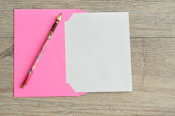 istock Pink envelope with a piece of paper 587206058