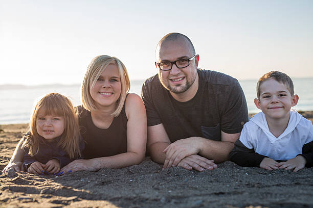 istock Family having great time ocean 587206462