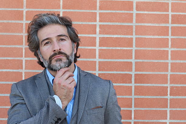 istock Thinking mature bearded man in a suit 587208374