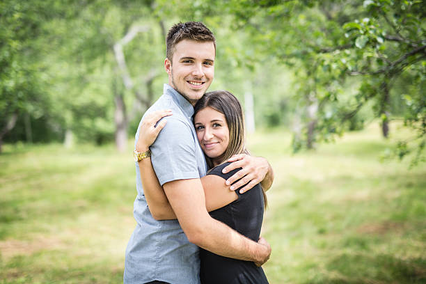 istock Happy loving young couple at the park 587214016
