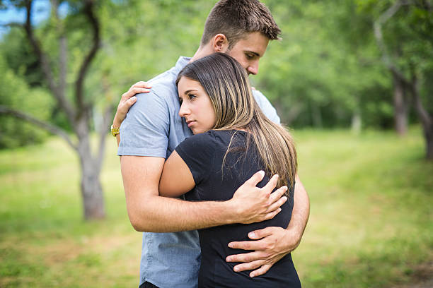 istock Happy loving young couple at the park 587214152