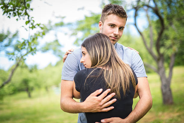 istock Happy loving young couple at the park 587214184
