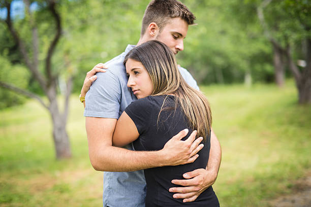 istock Happy loving young couple at the park 587214244