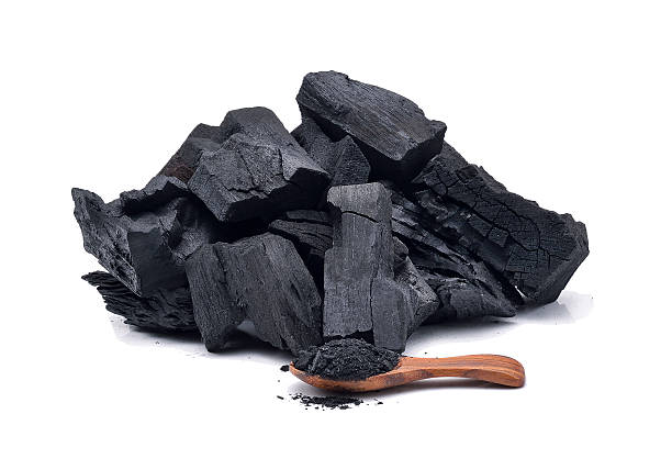 istock Hard wood charcoal isolated on white 587214330