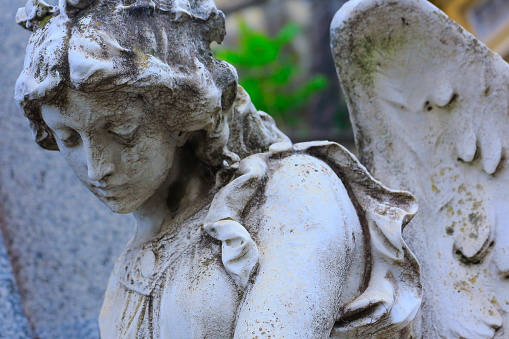 Young sad, beautiful fragile Madonna Angel, Recoleta cemetery, Buenos Aires